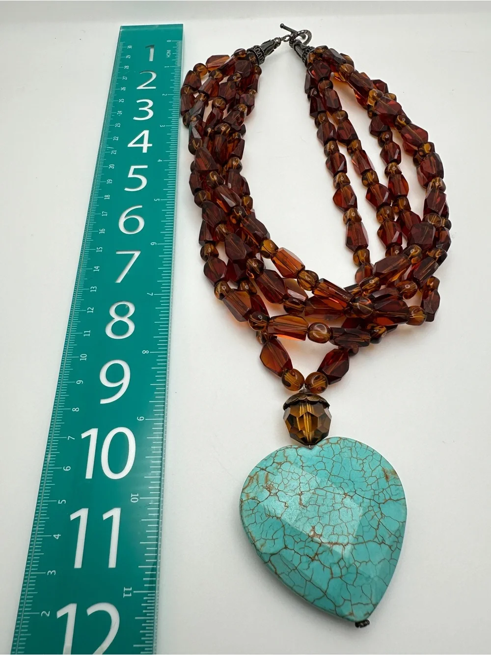 Multi-Strand Amber Glass Necklace with Turquoise Heart Pendant